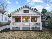 Charming renovated craftsman-style home with a welcoming front porch, featuring a new paint job and landscaped yard at 634 Delmar Se Ave, Atlanta, GA 30312