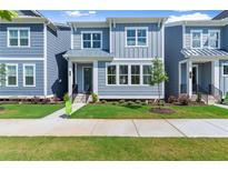 Charming new construction home with blue siding, manicured lawn, and welcoming entrance at 1937 Quarry Park Nw Pl, Atlanta, GA 30318