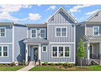 Charming two-story townhome with gray siding, white trim, and a well-manicured front yard at 1941 Quarry Park Nw Pl, Atlanta, GA 30318