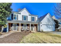 Charming two-story home with a welcoming front porch and well-maintained landscaping at 2389 Lake Villas Ln, Duluth, GA 30097