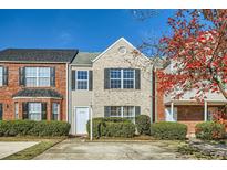 Charming townhouse with stone and vinyl siding and manicured landscaping at 2720 Marlin Dr, Mcdonough, GA 30253