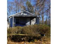 Charming home featuring a covered porch area and some landscaping at 571 Grant Sw St, Atlanta, GA 30315