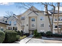 A welcoming exterior view of a condo building with well-maintained landscaping and architectural details at 3655 Habersham Ne Rd # B148, Atlanta, GA 30305