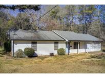 Charming single-story home featuring durable white siding, neutral roofing, and a well-maintained lawn at 170 Roberts Rd, Covington, GA 30016