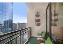 Relax on this cozy balcony with great city views, complete with seating and decorative accents at 3445 Stratford Ne Rd # 2305, Atlanta, GA 30326