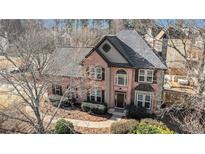 Charming two-story brick home boasts classic curb appeal and a welcoming facade at 3215 Belford Drive, Marietta, GA 30066