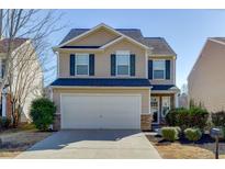 Charming two-story home with neutral siding, a two-car garage, and well-maintained landscaping at 2650 Richfield Pl, Cumming, GA 30040