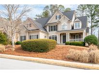 Charming two-story traditional home with landscaped front yard, well-manicured hedges, and covered front porch at 426 Highcrest Dr, Acworth, GA 30101
