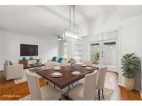 Bright dining room featuring hardwood floors, modern lighting, and neutral decor, perfect for entertaining at 955 Juniper Ne St # 1016, Atlanta, GA 30309