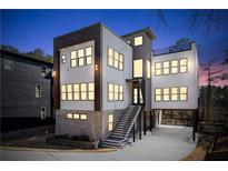 Modern home featuring a multi-level design, stone accents, and large windows at 412 Ashwood Sw Ave, Atlanta, GA 30315