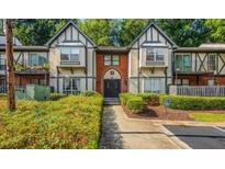 Charming two-story condo featuring Tudor accents, a landscaped entrance, and convenient accessible parking at 6851 Ne Roswell Ne Rd # I15, Sandy Springs, GA 30328