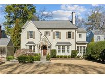 Charming two-story home with stone entryway, neutral paint, and manicured landscaping at 3114 Peachtree Ne Dr, Atlanta, GA 30305