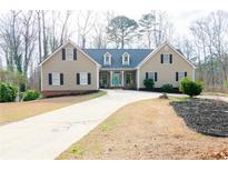 Charming single Gathering home with a neatly manicured lawn and inviting curb appeal at 814 Oak Moss Dr, Lawrenceville, GA 30043