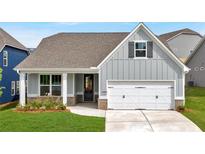Charming craftsman-style home with gray siding, white trim, and an attached two-car garage at 61 Colonial Terrace, Villa Rica, GA 30180