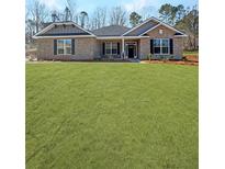 Charming one-story brick home featuring a well-manicured lawn and classic architectural details at 5301 Tuscany Dr, Douglasville, GA 30135
