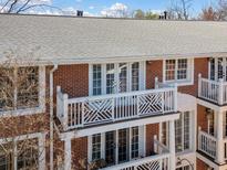 Charming brick building with white balconies and shuttered windows at 885 Briarcliff Ne Rd # 41, Atlanta, GA 30306
