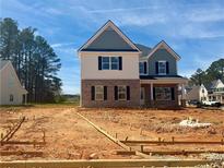 Charming two-story home featuring brick and white siding with a covered front porch and unfinished front yard at 3603 Squires Park Ln, Loganville, GA 30052