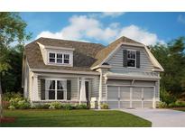 Charming two-story home showcasing meticulous landscaping and inviting curb appeal in a peaceful neighborhood at 53 Colonial Ter, Villa Rica, GA 30180