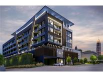 Contemporary apartment building featuring modern architecture with a sleek design and multiple stories with balconies at 567 Ponce De Leon Ne Ave # 312, Atlanta, GA 30308