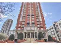 Low angle of a red brick high-rise building featuring repeating balconies on upper levels at 3435 Kingsboro Ne Rd # 1701, Atlanta, GA 30326