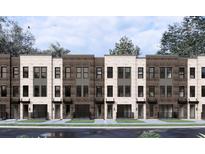 Modern townhome exterior featuring brick accents, large windows, and individual entryways at 901 Echo Park Dr, Suwanee, GA 30024
