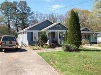 Charming bungalow-style home with well-maintained landscaping and a private driveway at 998 Sparks Sw St, Atlanta, GA 30310