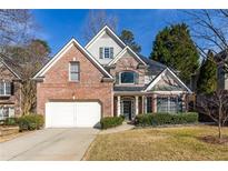 Charming two-story brick home with manicured landscaping and a two-car garage at 1224 Indian Hills Pkwy, Marietta, GA 30062