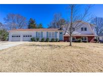 Charming two-story home features a two-car garage and inviting curb appeal at 1722 Johnston Nw Trl, Kennesaw, GA 30152