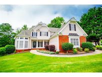 Charming two-story home with a well-manicured lawn and inviting curb appeal at 2003 Hubbard Ct, Villa Rica, GA 30180