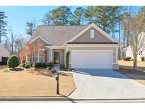 Charming single-story home with a two-car garage and well-maintained landscaping at 2887 Goldfinch Cir, Marietta, GA 30066