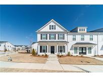 Charming two-story home with black shutters, white siding, and inviting front porch at 1703 Prospect Way, Conyers, GA 30094