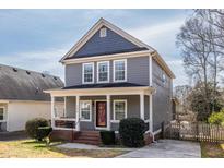 Charming two-story home featuring a covered front porch and well-maintained landscaping, ideal for suburban living at 134 Turman Se Ave, Atlanta, GA 30315