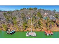 Stunning lakefront homes with private docks offer serene waterfront living at 2345 Pilgrim Mill Cir, Cumming, GA 30041