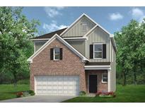 New two-story home featuring brick accents, an attached garage, and professionally landscaped yard at 724 Shetland Trl, Cartersville, GA 30121