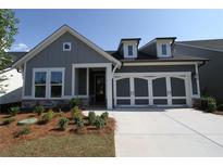Charming single-Gathering home featuring a two-car garage, and craftsman style front porch at 2040 Ripple Park Bnd, Canton, GA 30114