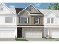 Charming brick and siding townhome with a two-car garage and well-manicured lawn at 208 Bastian Dr # 108, Villa Rica, GA 30180