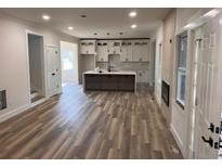 Spacious open-concept kitchen featuring a center island, stainless appliances, and ample counter space at 1400 Bouldercrest Rd, Atlanta, GA 30316