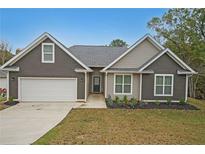 Charming home with a front-facing garage, neutral color palette, and a well-manicured front yard at 92 Fairview Oak Trce, Dallas, GA 30157