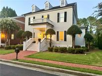 Charming two-story home with a welcoming front porch and well-manicured landscaping at 3987 St Georges Ct, Duluth, GA 30096