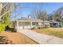 Charming one-story home featuring a covered entrance, grey paint, and a well-maintained front yard at 3449 Hyland Dr, Decatur, GA 30032