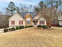 Charming single-Gathering home with a well-manicured lawn and inviting front porch at 764 Whitby Dr, Douglasville, GA 30134