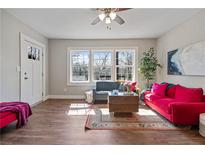 Bright living room featuring hardwood floors, large windows, and modern furnishings at 1686 Terry Mill Se Rd, Atlanta, GA 30316