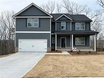 Beautiful two-story home featuring a two-car garage and inviting front porch at 19 Loth Wages (Lot 19) Rd, Dacula, GA 30019