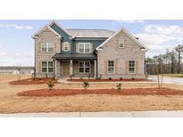 Charming two-story home with a brick facade, complemented by a well-manicured front yard at 700 Hedwig Drive (Lot 91), Mcdonough, GA 30252