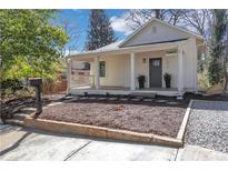 Charming single-story home with a welcoming front porch and well-maintained landscaping at 1576 Elixir Sw Ave, Atlanta, GA 30314