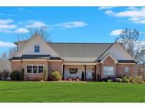 Charming single-Gathering home with a covered porch and manicured lawn, offering great curb appeal at 915 Pool Rd, Hiram, GA 30141