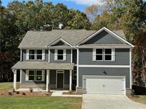 Beautiful two-story home with gray siding, white trim, and a two-car garage at 1114 Campbell Rd, Covington, GA 30014