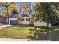 Charming single-story home featuring a cozy front porch and well-maintained lawn at 1697 Dyson Ne Dr, Atlanta, GA 30307