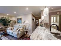 Comfortable living room features a plush sofa, stylish decor, and marble countertops at 300 Johnson Ferry Ne Rd # A403, Atlanta, GA 30328