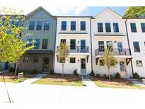 A row of new townhomes featuring modern architectural details and landscaping at 972 Bibbs Circle # 13, Atlanta, GA 30318
